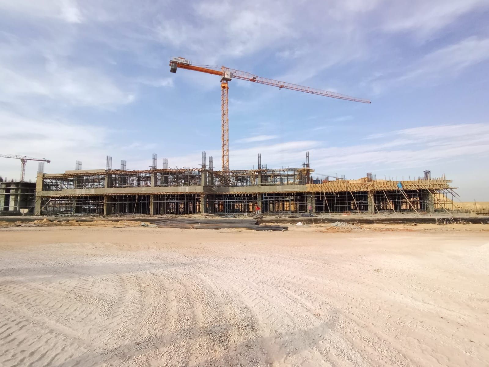The lower floors of LINX Tower in concrete, with formwork, scaffolding and a tower crane on site