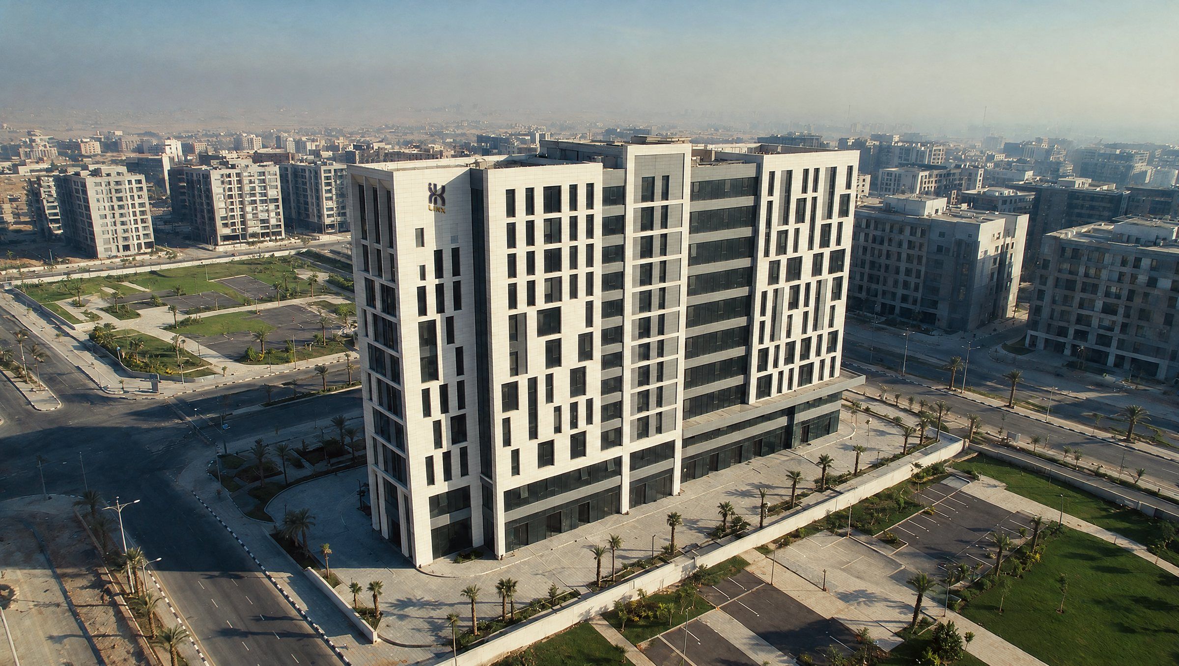 Aerial view of LINX Tower with the LINX logo, its landscaped plaza and the surrounding New Administrative Capital district